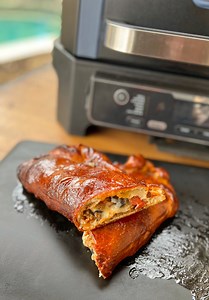 Woodfired Calzone! We’re using the Ninja Kitchen Woodfire Grill with Bear Mountain BBQ pellets to make this awesome meaty and cheesy calzone! So damn good!🔥#calzone #woodfire #woodfired #woodfiredpizza #calzones #ninjawoodfiregrill #ninjawoodfire 🔥 | Cooking with CJ