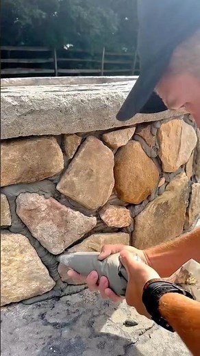 Grouting Natural Stone Walls: Applying Mortar with a Grout Bag for Finishing