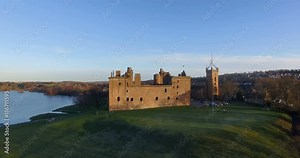 Aerial: Linlithgow Palace beside Linlithgow Loch, Scotland