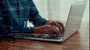 Computer programmer uses capable laptop computer to develop programming code of new software . Computer specialist working on future coding application for software programming development . Stock Video