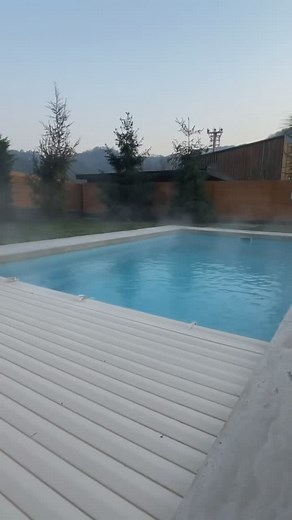 Poolcotec Slatted Automatic Pool Covers ✔️ 80% Heat Retention ✔️ 40% Energy Cost Savings ✔️ Extend Your Swimming Season Elegance meets efficiency—protect your pool while saving energy. Invest in the future of your pool today! 💦 #PoolCovers #AutomaticPoolCover #PoolLife #EnergySavings #SustainableSwimming | Poolcotec