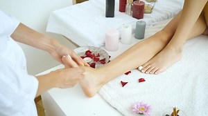 Foot massage of the client in the spa center. Medicine and health. Relax