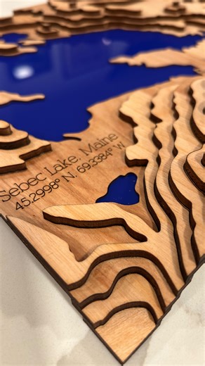 Sean recently made this custom topographic map of a very special place — Sebec Lake in Maine. Maps like this capture more than geography. They hold memories, time spent together, and the quiet beauty of places that stay with us long after we leave. There’s something really powerful about turning a meaningful landscape into a piece of art you can live with. #topographicmap #customwoodart #meaningfulplaces #maineinspired #sebeclake natureart handmadeart makerslife fromnature beautyinchange customm