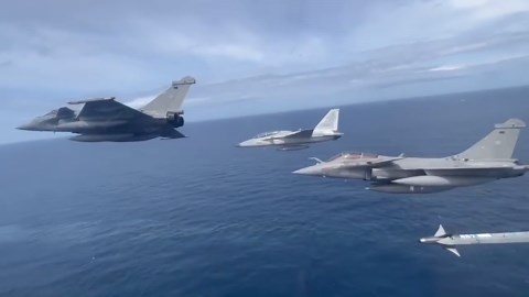 French and Filipino pilots fly alongside each other above Philippine seas