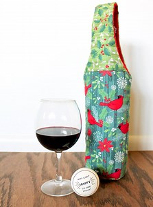 Personalize a storebought bottle of wine with a carrier that showcases favorite fabrics. Get the pattern here: http://www.allpeoplequilt.com/bags-pillows-gifts/gifts/craft-and-carry | American Patchwork & Quilting