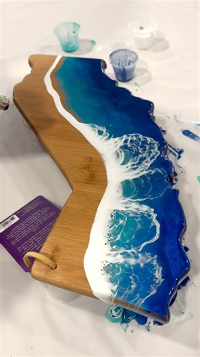 Was this California board done by our artist or one of our guests who never worked with epoxy resin before? At Art Magic Studio, honestly I invested thousands of dollars and countless hours of my time to find the best practices and recipes to get that perfect ocean look. It’s just a perfect combination of materials, timing and technique. And we share all that knowledge at our workshops | Art Magic Creative Studio | Facebook