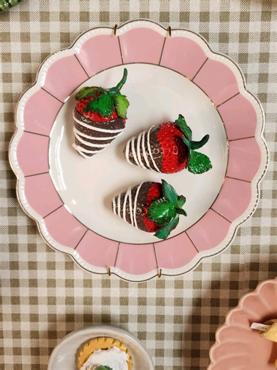A closer look at the polymer clay strawberries on my plate wall. #platewall #polymerclay
