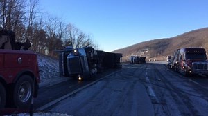 Police: 3 tractor trailers crash after being blown over by high winds