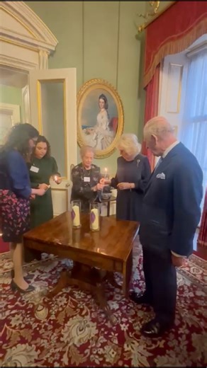 Oops! 🔥 Queen Camilla avoided a major fire hazard during today’s event as she marked Holocaust Memorial Day at Buckingham Palace. Thankfully, she and King Charles took it all in their stride! 😅 | HELLO!