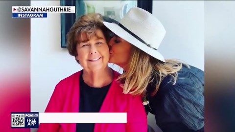Savannah Guthrie lays flowers outside Nancy Guthrie's home