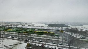 Bus stop, station with yellow and green buses. Movement of public transport.