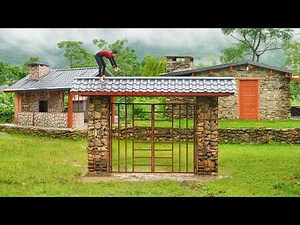 Try To Complete The Corrugated Iron Roof Stone Gate Under The Continuous Rain And Flood