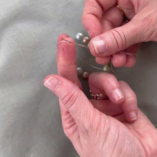 Use a crimp bead with elastic thread