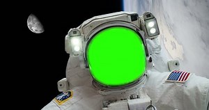 Green Screen Astronaut Spacewalk Floating Above Earth with Moon in Background some elements furnished by NASA images. The astronauts face has been green screen, so you can put someone else's face