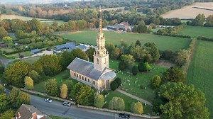 Church in village with tower bell and clock