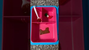 Packing school lunch as mom eats daughter’s lunch