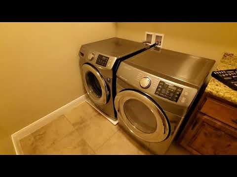 Camco Plastic Drain Pan Installed Under Samsung Front Load Washer - Protect Floor From Minor Leaks