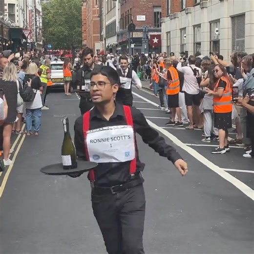 87K views · 560 reactions | On Sunday, about 50 professional waiters from across London competed in an annual waiters’ race designed to test their mettle, their coordination and their skill as servers. “It’s the Olympics for us waiters,” one participant said. https://nyti.ms/4cPMJTY | The New York Times | Facebook