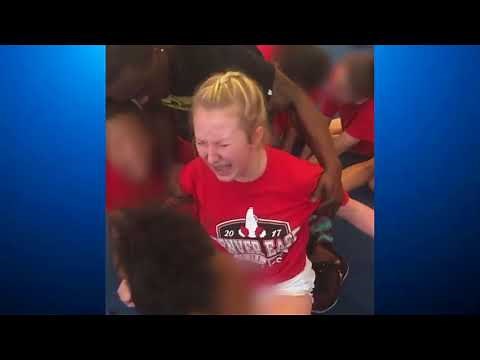 Cheerleader violently forced to do splits