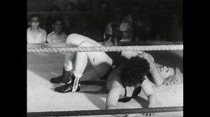 1950s - Women use leg moves in a professional wrestling match.