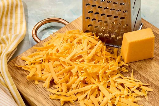 The Real Difference Between White And Yellow Cheddar Might Surprise You