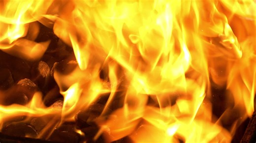 Slow motion fire close up in offset smoker BBQ Pit | Premium Stock Video Footage