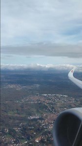 View of engine & wing as A350 climbs after take-off from Milan