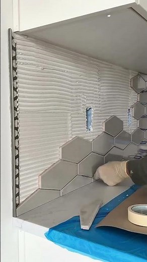 Installing Hexagon Tiles on a Wall for a Unique and Creative Room Renovation Activity Task