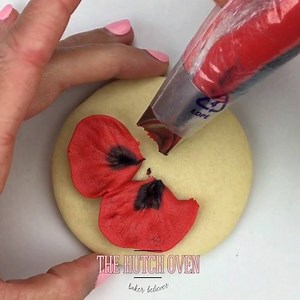 2.6K views · 121 reactions | Beautiful Poppy flower cookie in honor of Memorial Day to pay tribute to those who gave their lives for our freedom ❤️ Using @wiltoncakes petal tip 123 for the petals. For the center of the Poppy I used tip 363 and finished it off with tip 2 in black buttercream. Music | Forget Me Not, courtesy of @audionetwork ❤️ PLEASE SHARE  | Emily Hutchinson | Facebook