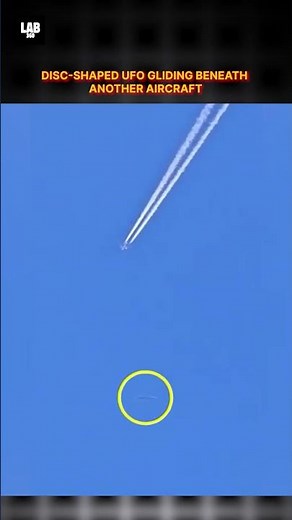 Unbelievable! Disc-Shaped UFO Glides Beneath a Passenger Plane #trending #ufo #shorts