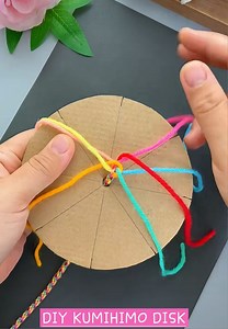 Waiting for your kumihimo kit? 🪢✨ This easy DIY kumihimo weaving tool is made with just cardboard and 7 colored yarn—perfect for beginners to practice while waiting for their kits. Simple, budget-friendly, and it really works! 💛🥰 #kumihimo #kumihimobraid #kumihimodisk #threadart #fiberart #handbraided #craftreels #viralreels #trendingreels #diybrace #diybracelet #diy #DIYProjects #fypageシ #fypreelsシ゚viralシ #fypageシ #fy #fypchallenge #fypagee #foryoupagereels #foryourpage #viralpage #fypシ #fyp