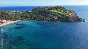 Aerial drone video of iconic archaeological site of Cape Sounio and famous Temple of Poseidon built uphill overlooking Aegean sea, Attica, Greece