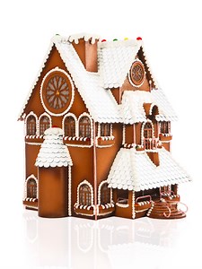 8.3M views · 314K reactions | This is my first attempt at a Gingerbread House (i've cheated by using chocolate) it was the best way for me to wish you all a Merry Christmas! Aside from the lightbulb everthing is edible. The house is made out of 100% dark chocolate, the windows are made out of sugar, the snow is royal icing, and all the colored accents are handmade gummies and candycane! | Amaury Guichon | Facebook