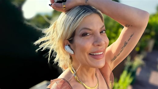 Tori Spelling, 51, critics rage 'grow up!' as star gushes over stomach piercings