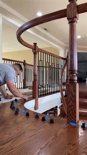 Installing new metal spindles on these refinished red oak stairs and landing 🪵 #diy #wood #home