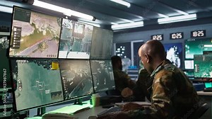 Army officers doing brainstorming in command center, looking at intel folder files. Intelligence corps experts read mission case paperwork to be informed on data on opponents strategy, camera B