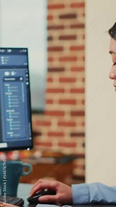 Vertical video: Professional IT engineer manufacturing industrial prototype component using cad software, developing machinery on interface. Creative technician creating craphic model, mechanical