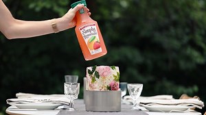 Chill in Style: freeze some wild flowers in an ice mold, cool a carafe of refreshing Simply Lemonade with Strawberry and enjoy the fruits of your labor. | Simply Beverages