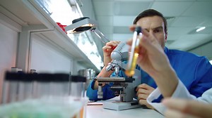 Laboratory research concept. Group of scientists discussing microscope research | Free Stock Video Footage
