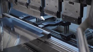 Steel machine metal press industry equipment. Hydraulic press bends. Steel sheet on bending machine forms metal products. Bending metal machine. Metalworking machine tool equipment factory steel plate