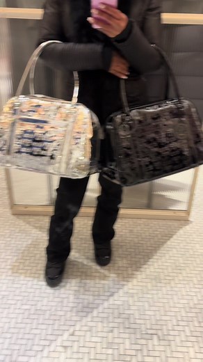 Choosing Between Silver and Black TNA Bags