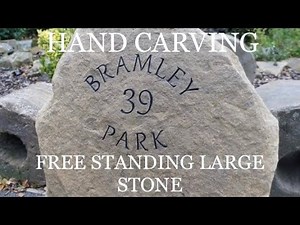 HAND CARVING a free standing natural faced house sign - stone lettering. - stone letter carving