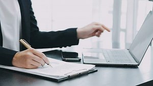 Portrait of Asian young female working on laptop at office