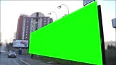 Green screen billboard on urban, city life. Blank advertisement...