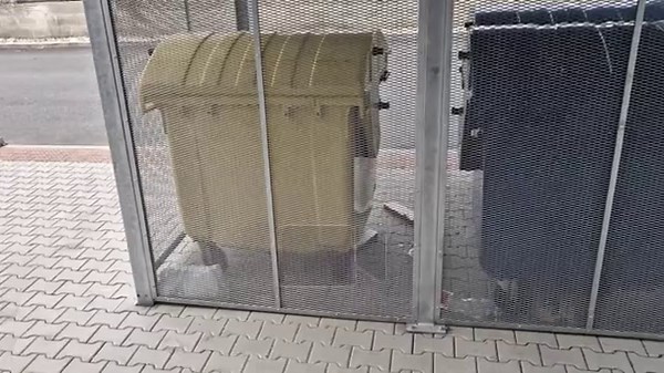 container stand, garbage can shelter metalmetal cut and stretched grid pattern, Material durability of welded steel profiles, corrosion protection hot-dip galvanized. sliding gate, flat roof of corrugated iron , house with concrete casting Stock Video Footage - Alamy