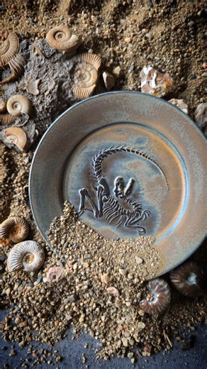 Kelsey Schroeder on Instagram: "Each fossil plate gets a layer of engobe before going through the bisque firing to create the fossil color. The colors are easy to tell apart before firing, but after the bisque they look nearly identical. Each engobe dramatically changes the color of the final glaze, so I made little tiles out of colored clay that I can place on my stacks of plates with the same engobe before going into the kiln. They can now be easily tracked on my shelves so I can be sure I'm a