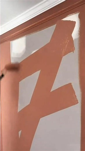 painting the walls of a room with a roller to give a new and clean atmosphere to the home interior