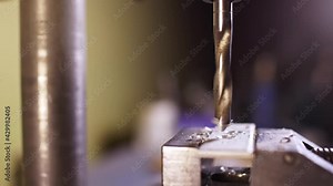 Shot of a drilling machine rotation at the workplace of a toolman locksmith, UHD 4k macro video