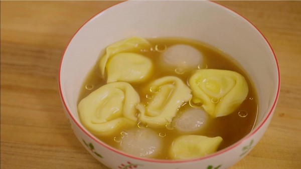 Charred cipollini brodo with tortellini, a culinary delight