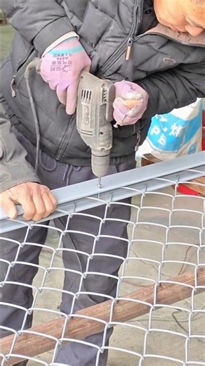 Installing Wire Mesh onto a Metal Frame Using an Electric Drill for Secure Fastening #shorts